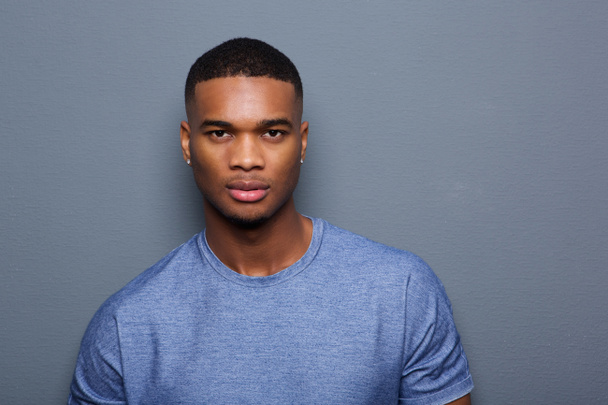 Handsome young black man with serious expression on face - Foto, immagini