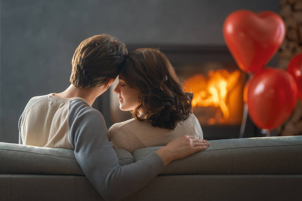 Happy loving couple on valentine's day. Man and woman are enjoying spending time at home. - Foto, Imagem