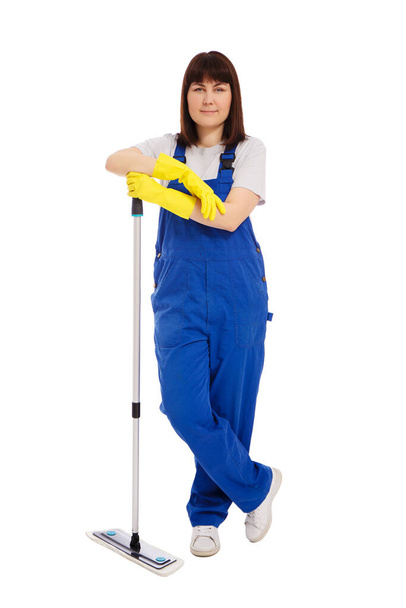 professional cleaning service concept - portrait of attractive woman cleaner in blue uniform posing with mop isolated on white background - Photo, Image
