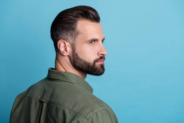 Profile photo of confident successful bearded guy barbershop ad concept wear green shirt isolated blue color background - Foto, immagini
