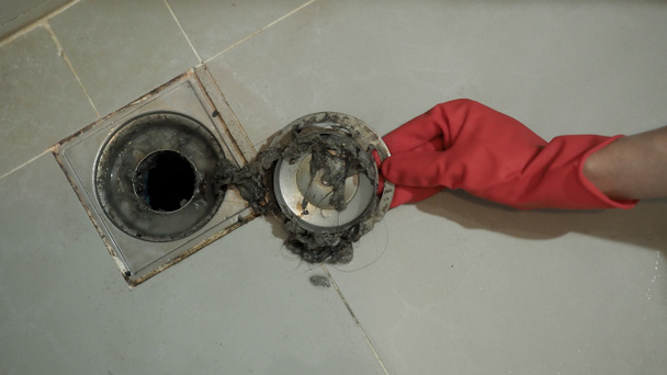 Drain cleaning. Clogged and dirty sewer pipes floor drain. Full of hair and accumulated clogged grease. Maintenance the floor drain sewage system in bathroom. fixing clean wash and unclog a drain. - Photo, Image