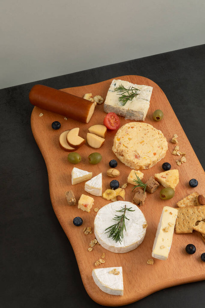 cheese plate with black background - Fotoğraf, Görsel