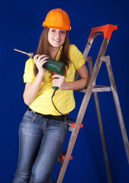 Female worker with drill - Фото, зображення