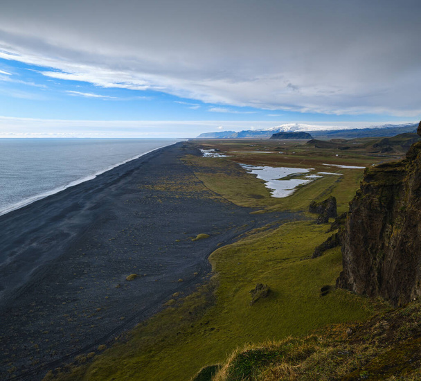 Picturesque autumn evening view to endless ocean  black volcanic sand beach from Dyrholaey Cape Viewpoint, Vik, South Iceland. - Фото, изображение