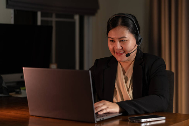 Telemarketing customer service asian woman working in call center office - Fotó, kép