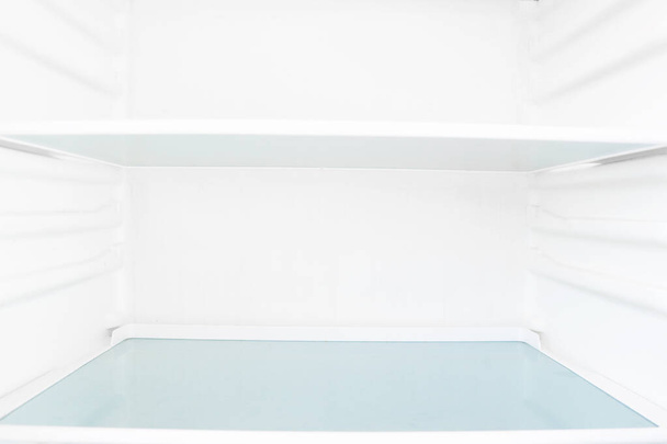 White open empty refrigerator. Weight loss diet concept. - Foto, Bild