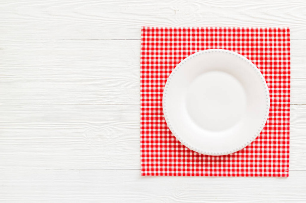 Table setting for dinner. Empty plate on napkin - dishware top view - Valokuva, kuva