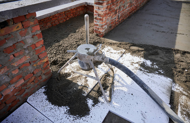 Concrete screed mixer machine at construction site. - Photo, Image
