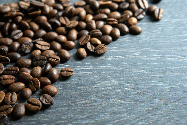 coffee beans on a wooden background close up - Photo, Image