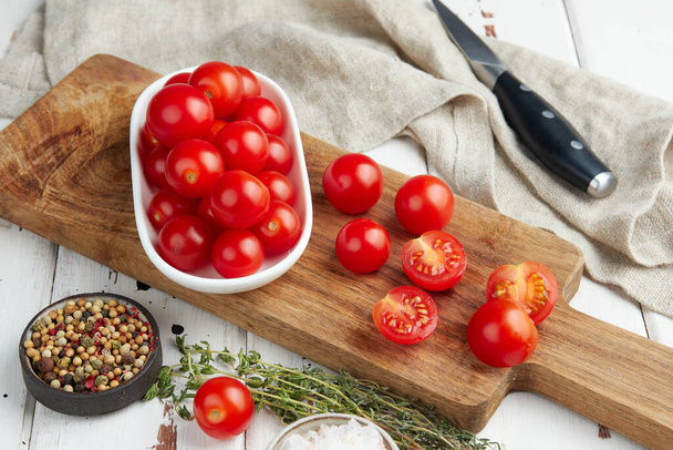 Fresh red cherry tomatoes on white wooden background - Fotografie, Obrázek