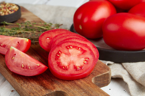 Fresh red tomatoes, close-up of fresh, ripe tomatoes on wooden background - Фото, зображення