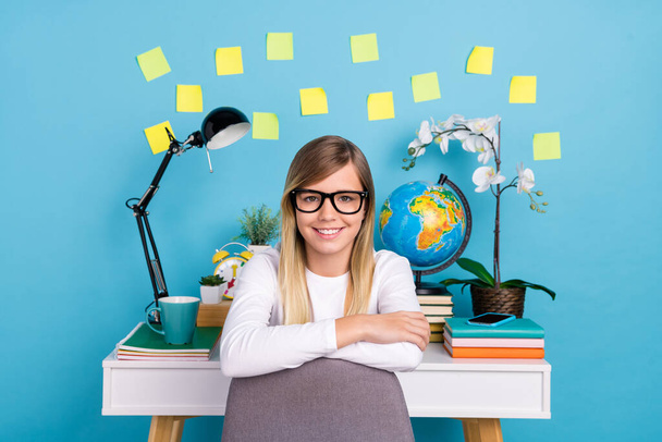 Portrait of attractive cheerful girl studying home comfort place homework isolated over vibrant blue color background - Φωτογραφία, εικόνα