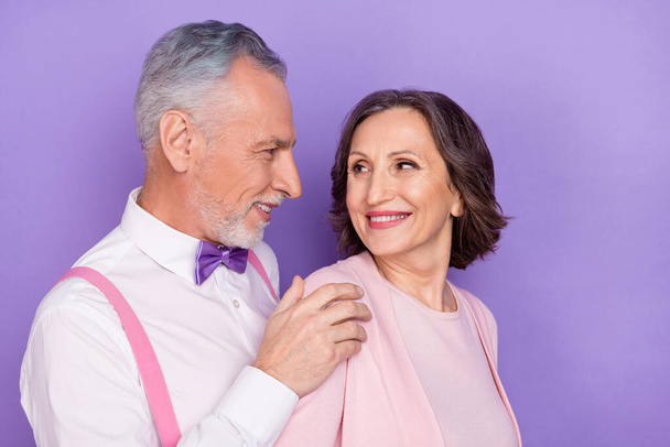 Photo of two positive partners hug touch shoulder care support isolated on violet color background - Фото, зображення