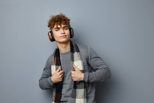 handsome guy elegant style checkered scarf headphones isolated background - Фото, зображення
