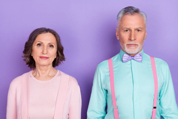 Photo of classy attractive partners look camera isolated on pastel purple color background - Фото, изображение