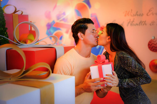 diverse couple caucasian husband and asian wife having fun and romantic moments together in valentine day or wedding anniversary - 写真・画像