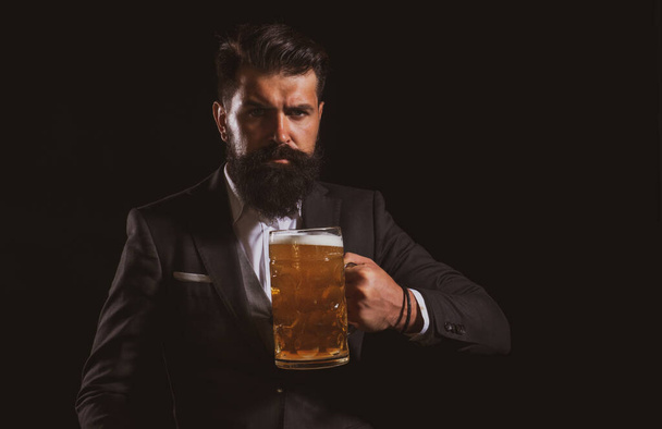 Beer pubs and bars. Man holding mug of beer. Happy brewer holding glass with beer. - 写真・画像