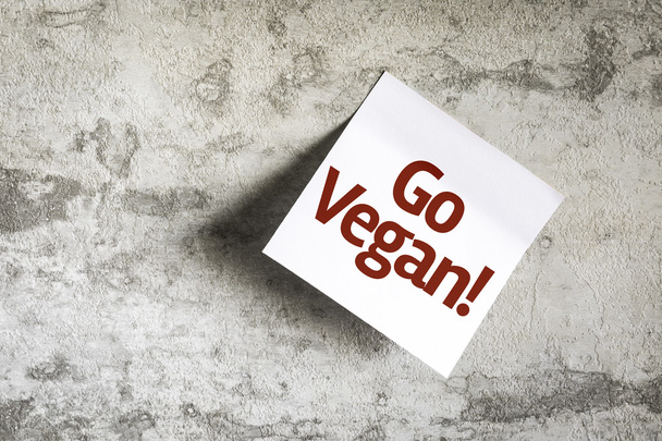 Go Vegan on Paper Note on texture background - Photo, Image