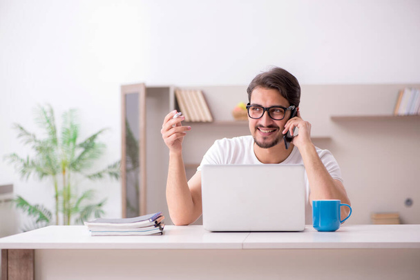 Young male freelancer working from home - Φωτογραφία, εικόνα