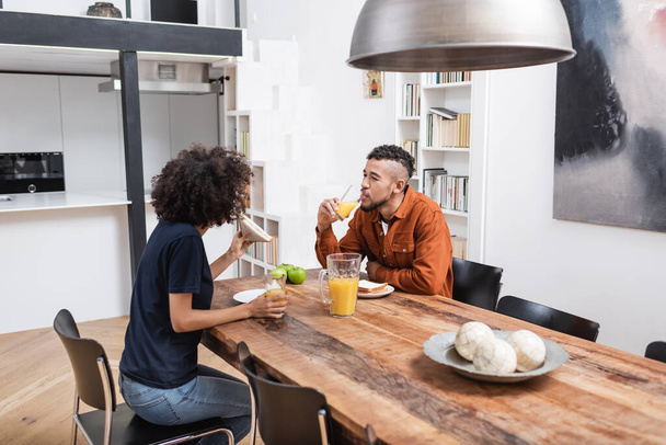 african american having lunch in modern kitchen  - Photo, Image