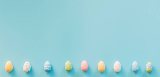 Easter eggs on blue background with copy space for text - Photo, Image