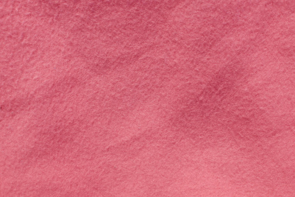 Fieltro pacífico rosa suave textura de fondo de material textil áspero de cerca, mesa de póquer, pelota de tenis, mantel. Fondo de tela blanca vacía. - Foto, imagen