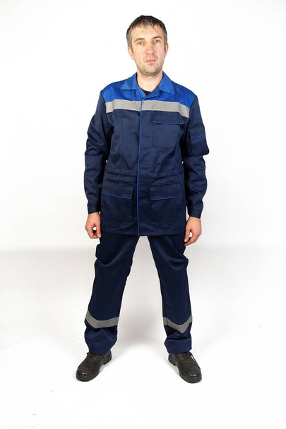 A man in overalls and work wear.Isolated studio portarit - Fotografie, Obrázek