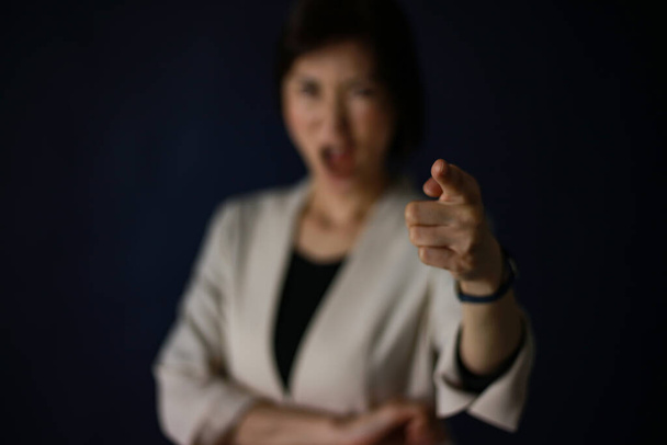 angry young  asian  business woman  in studio  - Fotó, kép