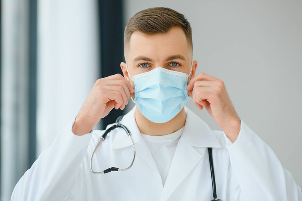 close up portrait of medical doctor in mask with copy space - Foto, Bild