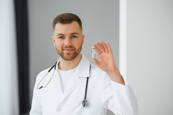 Young and confident male doctor portrait. Successful doctor career concept. - Foto, Bild