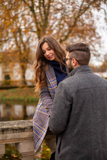 Happy young european married couple outside in fall - Фото, изображение