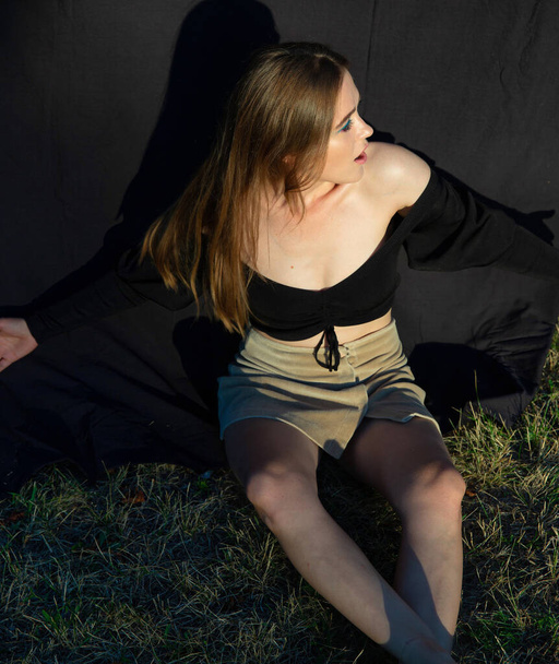 European young woman with white skin isolated on dark brown - Foto, afbeelding