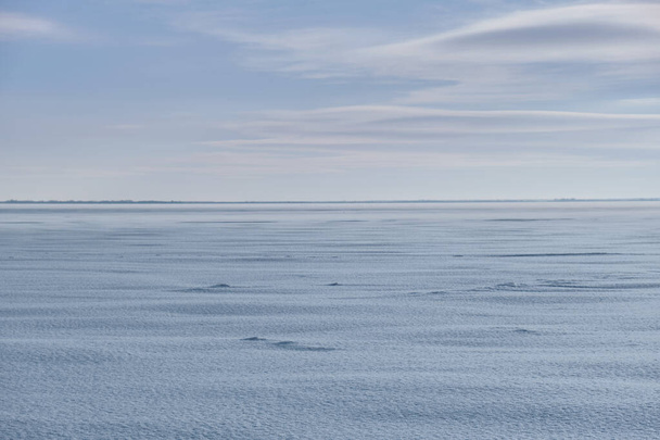View of an empty snow-covered field with the horizon - Фото, зображення