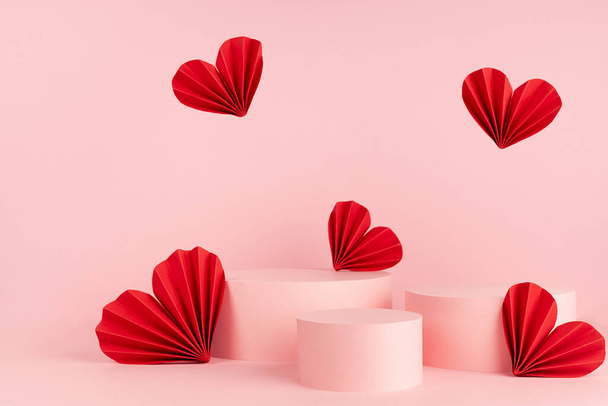 Valentines day pink stage mockup with set of three different circle podiums, red love paper hearts fly, copy space. Romance template scene for advertising, presentation cosmetic product, design. - Zdjęcie, obraz
