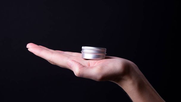 packaging of hand cream in female hands - Foto, Imagem