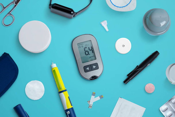 Diabetes supplies and devices on desk. Top view flat lay composition - Foto, imagen