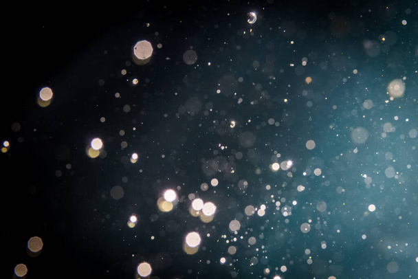 Abstract glitter bokeh on black background - Photo, Image