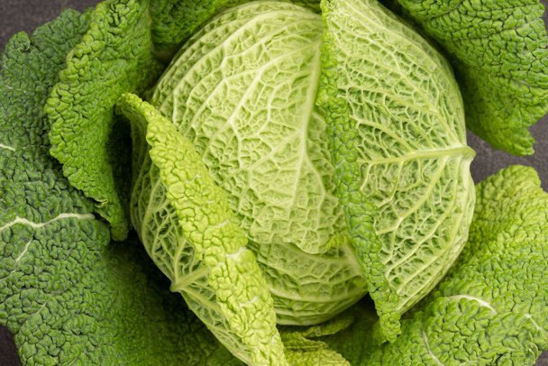 Savoy cabbage close-up. Flat lay. Black background. - Photo, Image