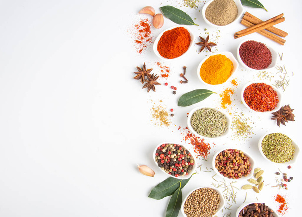 Assorted various spices on white background - Photo, image