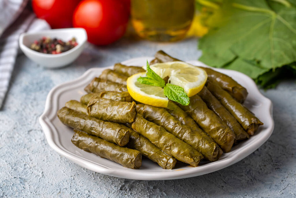 Traditional delicious Turkish foods; stuffed leaves (yaprak sarmasi) - Foto, afbeelding