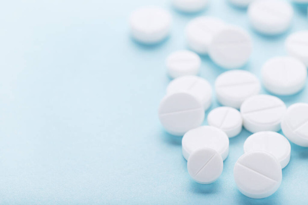 Medicine pills on blue background - Фото, изображение