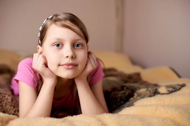 Portrait of a little girl in bed - Photo, image