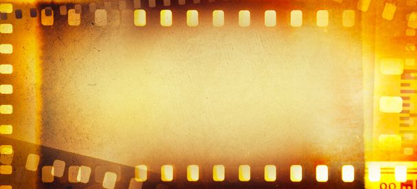 Film negatieve frames oranje achtergrond - Foto, afbeelding