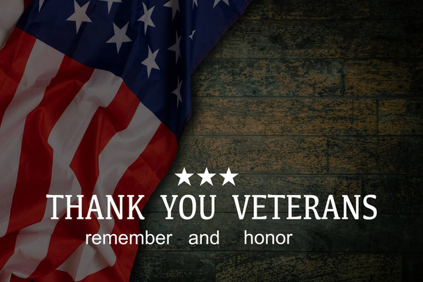 Veterans day. Honoring all who served. American flag on cement background - Photo, Image