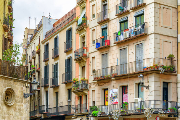 Barcelona, Spain - August 21, 2014: Scenic balconies of old houses in the Gothic Quarter. Barcelona is a popular tourist destination of Europe. - Φωτογραφία, εικόνα