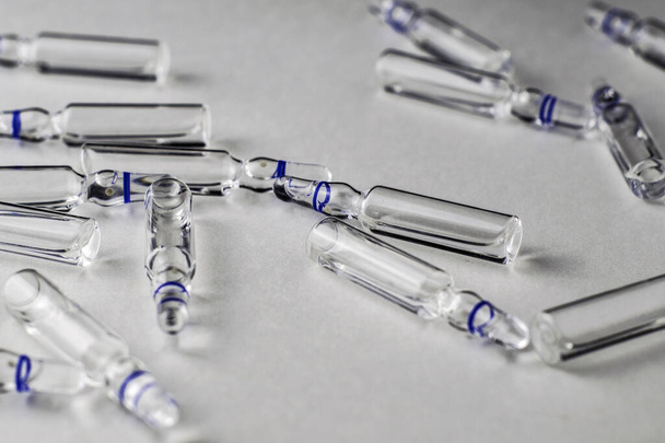 randomly lying ampoules with medicines on a white background. High quality photo - Fotografie, Obrázek