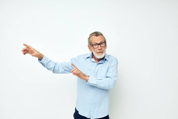 Portrait elderly man lifestyle posing hand gesture isolated background - Photo, image