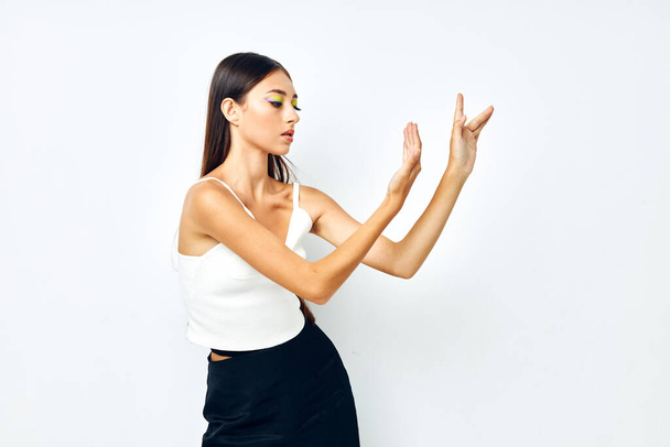 young woman white t shirt hand gestures charm isolated background unaltered - Photo, image