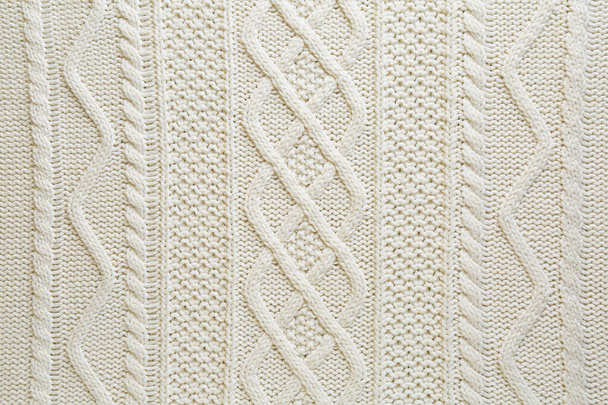 White knitted fabric with beautiful pattern as background, top view - Foto, immagini