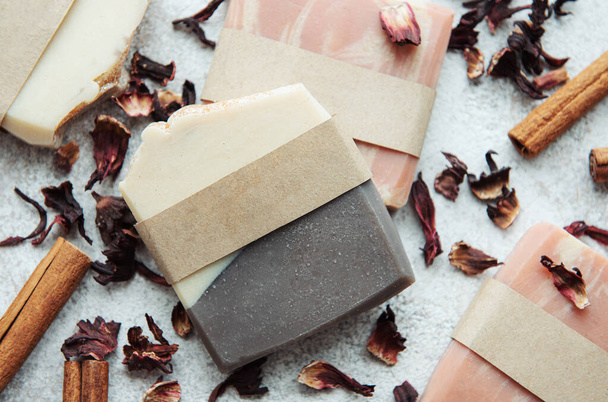 Spa setting witn natural handmade soap with cinnamon and flower petals  - Photo, Image